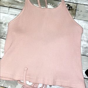 Light pink tank top with laced back.